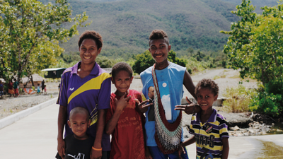 five young boys smiling at camera