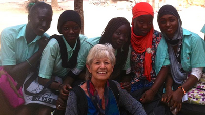 photo of 5 young woman and one older woman smiling at camera