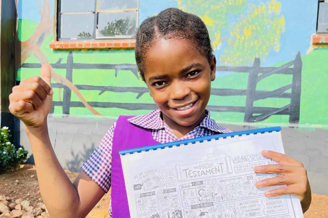 young girl showing drawing